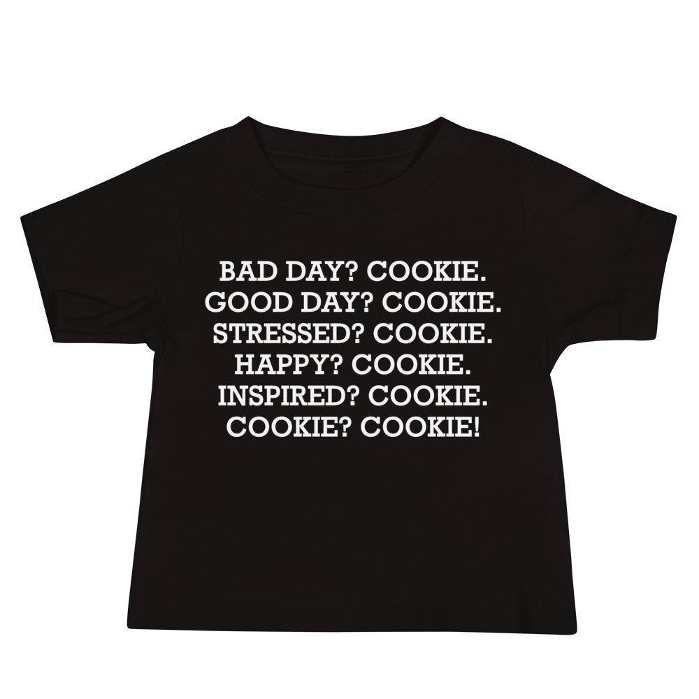 "Bad Day? Cookie. Good Day? Cookie. Stressed? Cookie. Happy? Cookie. Inspired? Cookie. Cookie? Cookie!" printed on a black baby jersey short sleeve tee laying on a flat surface