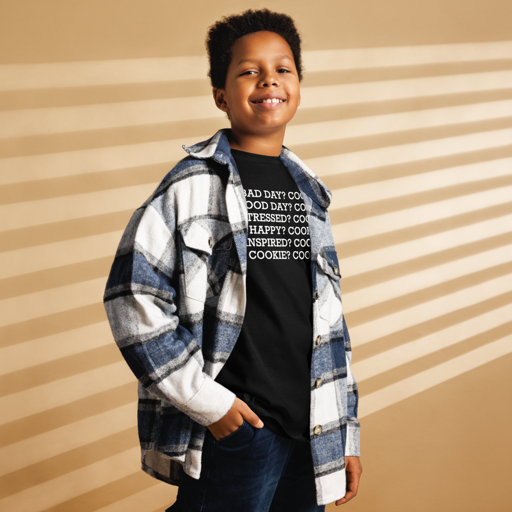 "Bad Day? Cookie. Good Day? Cookie. Stressed? Cookie. Happy? Cookie. Inspired? Cookie. Cookie? Cookie!" printed on a black youth classic tee worn by a male also wearing a jacket