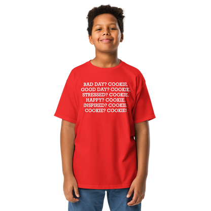 "Bad Day? Cookie. Good Day? Cookie. Stressed? Cookie. Happy? Cookie. Inspired? Cookie. Cookie? Cookie!" printed on a red youth classic tee worn by a male