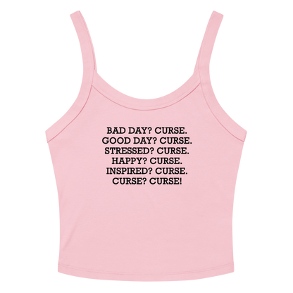 "Bad Day? Curse. Good Day? Curse. Stressed? Curse. Happy? Curse. Inspired? Curse. Curse? Curse!" printed on a solid pink blend women's micro-rib tanktop laying on a flat surface amongst sunglasses and shorts