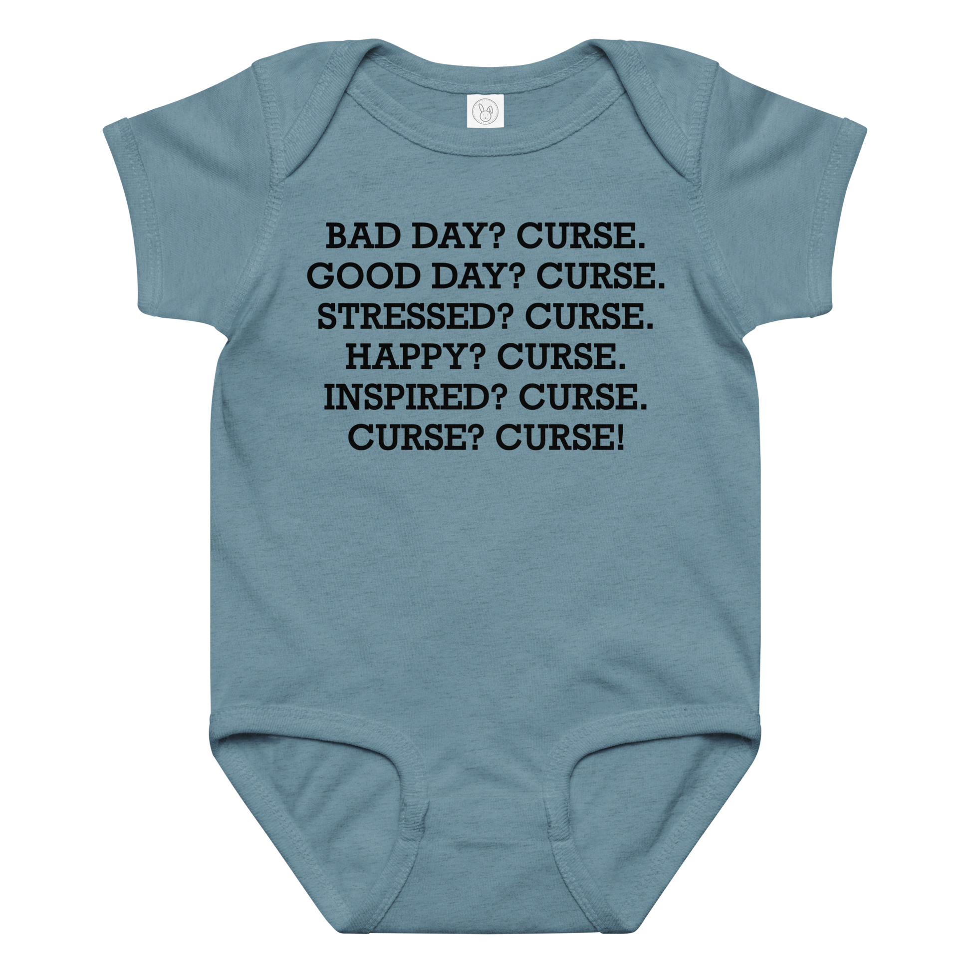"Bad Day? Curse. Good Day? Curse. Stressed? Curse. Happy? Curse. Inspired? Curse. Curse? Curse!" printed on a vintage indigo baby jersey bodysuit laying on a flat surface amongst other clothes