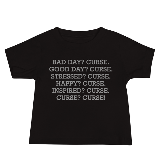 "Bad Day? Curse. Good Day? Curse. Stressed? Curse. Happy? Curse. Inspired? Curse. Curse? Curse!" printed on a black baby jersey short sleeve tee laying on a flat surface