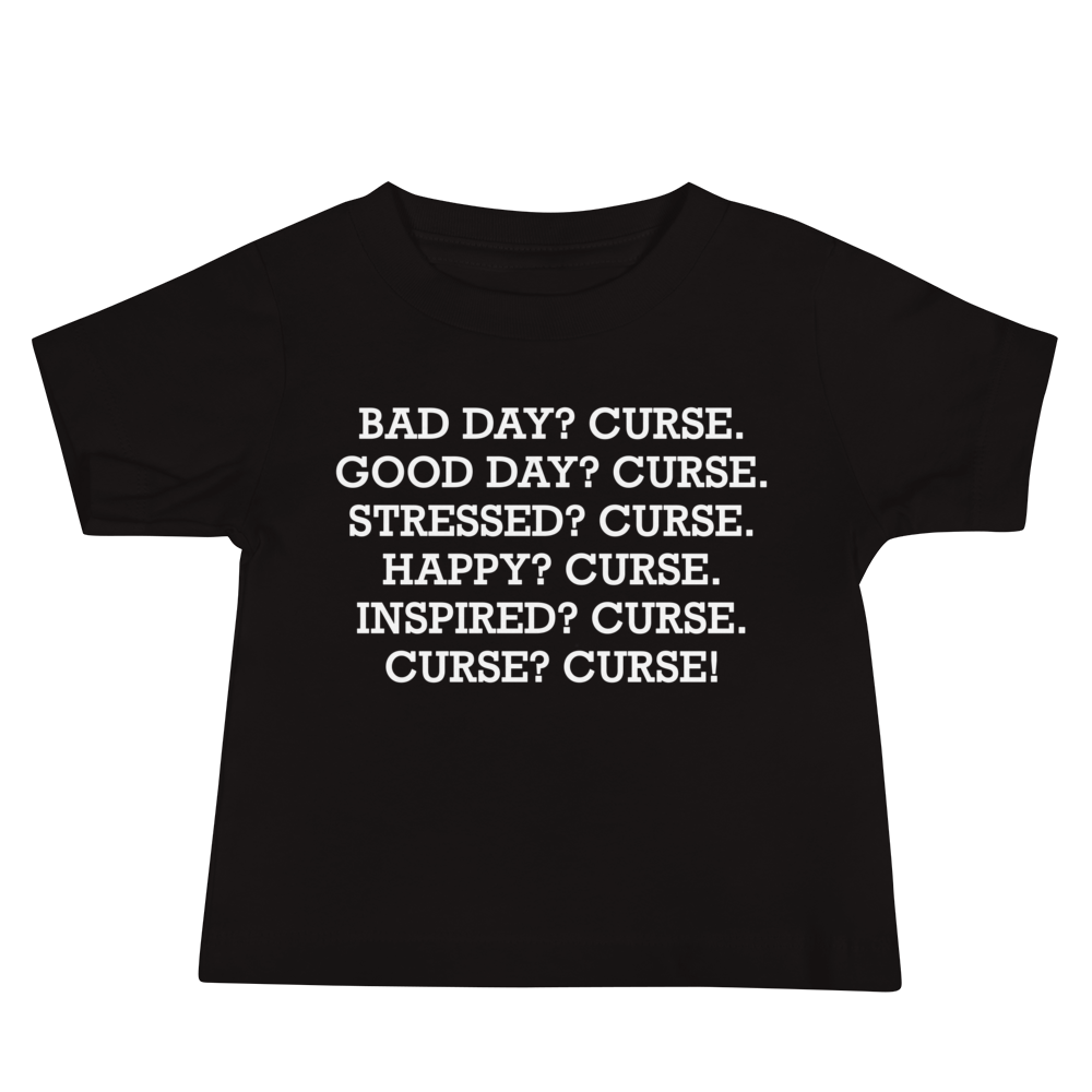 "Bad Day? Curse. Good Day? Curse. Stressed? Curse. Happy? Curse. Inspired? Curse. Curse? Curse!" printed on a black baby jersey short sleeve tee laying on a flat surface
