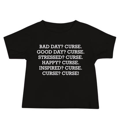 "Bad Day? Curse. Good Day? Curse. Stressed? Curse. Happy? Curse. Inspired? Curse. Curse? Curse!" printed on a black baby jersey short sleeve tee laying on a flat surface