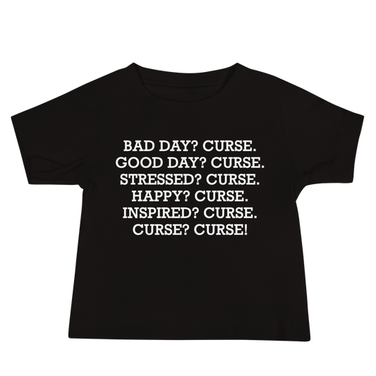 "Bad Day? Curse. Good Day? Curse. Stressed? Curse. Happy? Curse. Inspired? Curse. Curse? Curse!" printed on a black baby jersey short sleeve tee laying on a flat surface