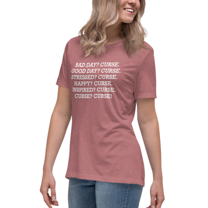 "Bad Day? Curse. Good Day? Curse. Stressed? Curse. Happy? Curse. Inspired? Curse. Curse? Curse!" printed on a heather mauve women's relaxed t-shirt worn by a female