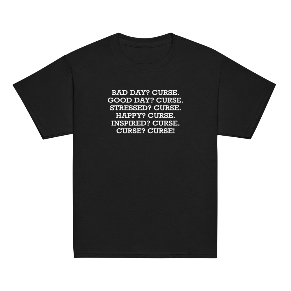 "Bad Day? Curse. Good Day? Curse. Stressed? Curse. Happy? Curse. Inspired? Curse. Curse? Curse!" printed on a black youth classic tee laying on a flat surface