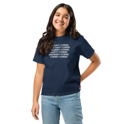 "Bad Day? Curse. Good Day? Curse. Stressed? Curse. Happy? Curse. Inspired? Curse. Curse? Curse!" printed on a navy youth classic tee worn by a female