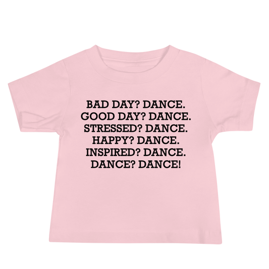 "Bad Day? Dance. Good Day? Dance. Stressed? Dance. Happy? Dance. Inspired? Dance. Dance? Dance!" printed on a pink baby jersey short sleeve tee laying on a flat surface