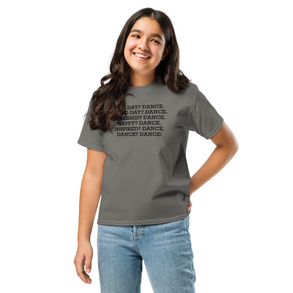 "Bad Day? Dance. Good Day? Dance. Stressed? Dance. Happy? Dance. Inspired? Dance. Dance? Dance!" printed on a charcoal youth classic tee worn by a female