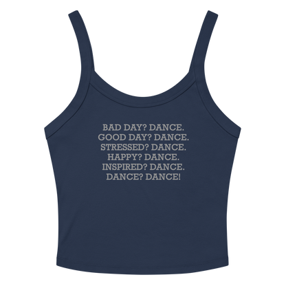 "Bad Day? Dance. Good Day? Dance. Stressed? Dance. Happy? Dance. Inspired? Dance. Dance? Dance!" printed on a solid navy blend women's micro-rib tanktop laying on a flat surface amongst sunglasses and shorts