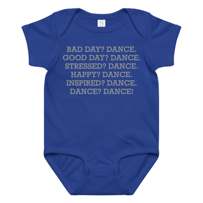 "Bad Day? Dance. Good Day? Dance. Stressed? Dance. Happy? Dance. Inspired? Dance. Dance? Dance!" printed on a royal baby jersey bodysuit laying on a flat surface amongst other clothes