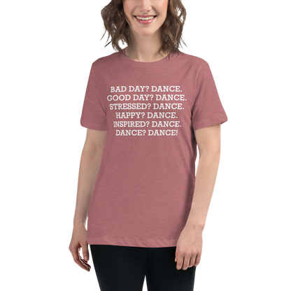 "Bad Day? Dance. Good Day? Dance. Stressed? Dance. Happy? Dance. Inspired? Dance. Dance? Dance!" printed on a heather mauve women's relaxed t-shirt worn by a female