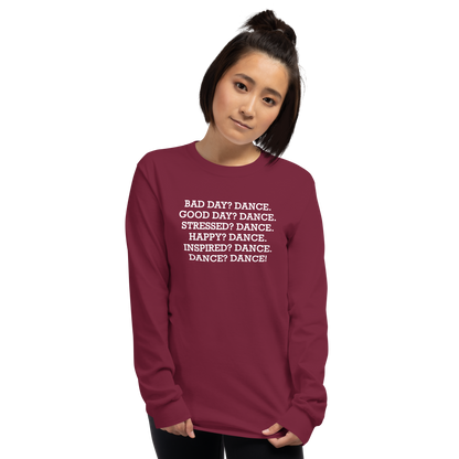 "Bad Day? Dance. Good Day? Dance. Stressed? Dance. Happy? Dance. Inspired? Dance. Dance? Dance!" printed on a maroon men's long sleeve shirt worn by a female