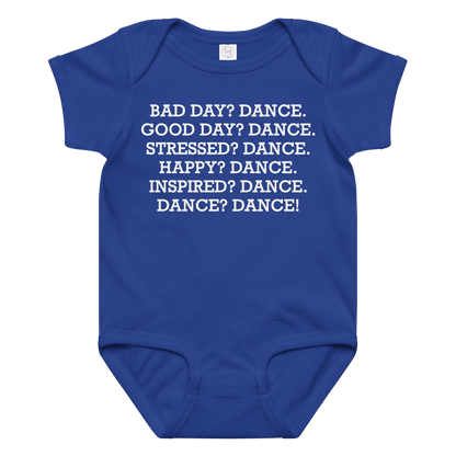 "Bad Day? Dance. Good Day? Dance. Stressed? Dance. Happy? Dance. Inspired? Dance. Dance? Dance!" printed on a royal baby jersey bodysuit laying on a flat surface amongst other clothes