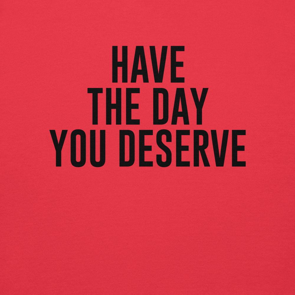 "Have the day you deserve" printed on a team red background