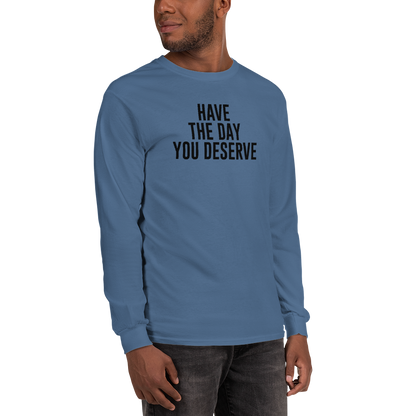 "Have the day you deserve" printed on a indigo blue men's long sleeve shirt worn by a male