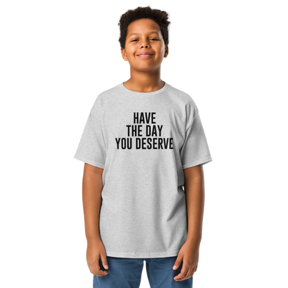 "Have the day you deserve" printed on a sport grey youth classic tee worn by a male