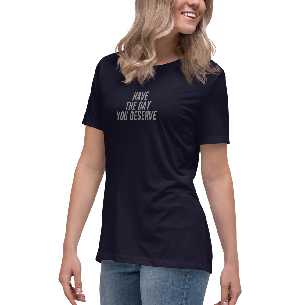 "Have the day you deserve" printed on a navy women's relaxed t-shirt worn by a female
