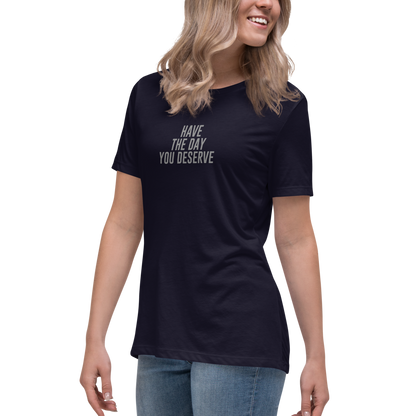 "Have the day you deserve" printed on a navy women's relaxed t-shirt worn by a female