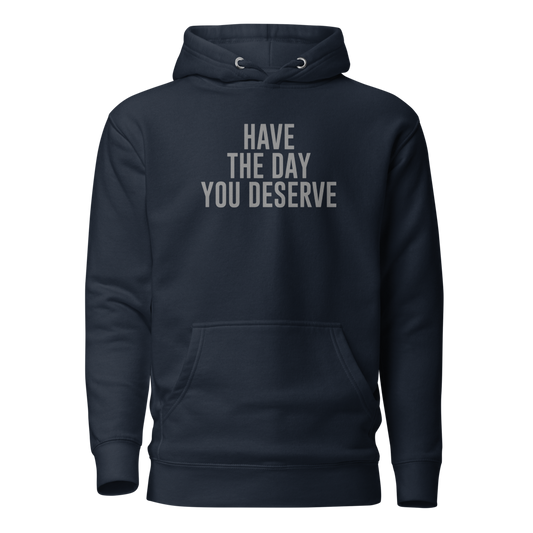 "Have the day you deserve" printed on a navy blazer on an invisible / simulated body