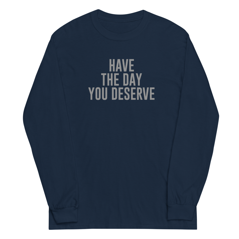 "Have the day you deserve" printed on a navy men's long sleeve shirt laying on a flat surface