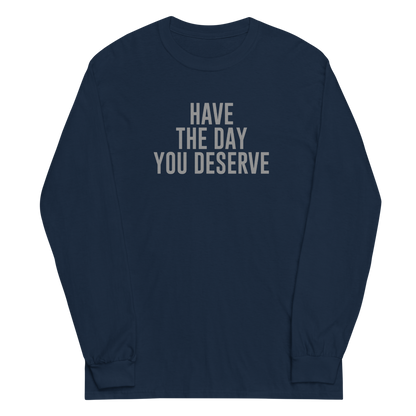 "Have the day you deserve" printed on a navy men's long sleeve shirt laying on a flat surface