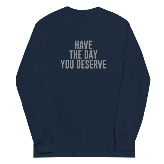 "Have the day you deserve" printed on a navy men's long sleeve shirt laying on a flat surface