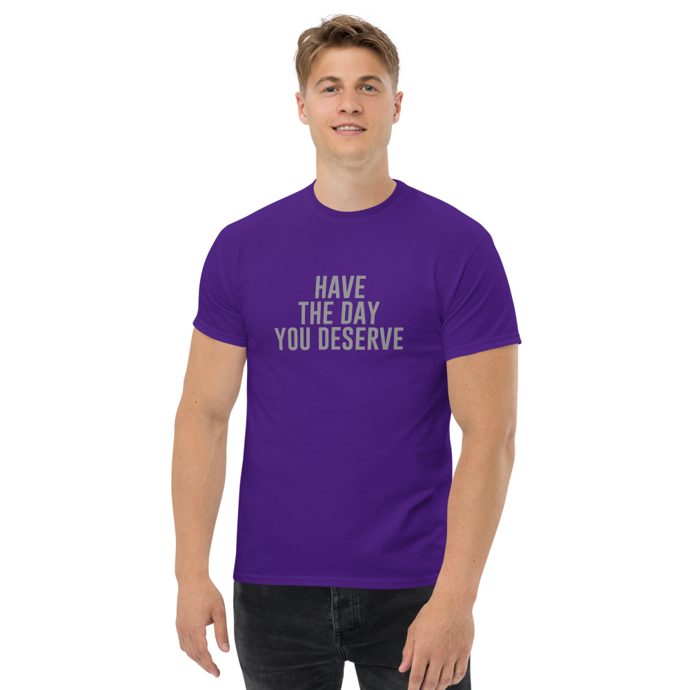 "Have the day you deserve" printed on a purple unisex classic tee worn by a male