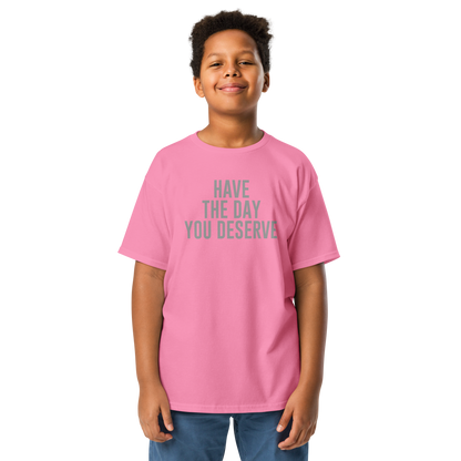 "Have the day you deserve" printed on a azalea youth classic tee worn by a male