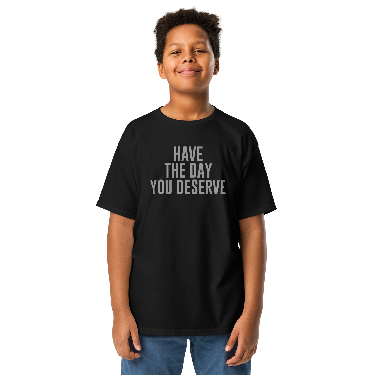 "Have the day you deserve" printed on a black youth classic tee worn by a male