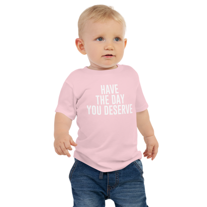 "Have the day you deserve" printed on a pink baby jersey short sleeve tee worn by a male