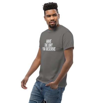"Have the day you deserve" printed on a charcoal unisex classic tee worn by a male