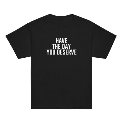 "Have the day you deserve" printed on a black youth classic tee laying on a flat surface