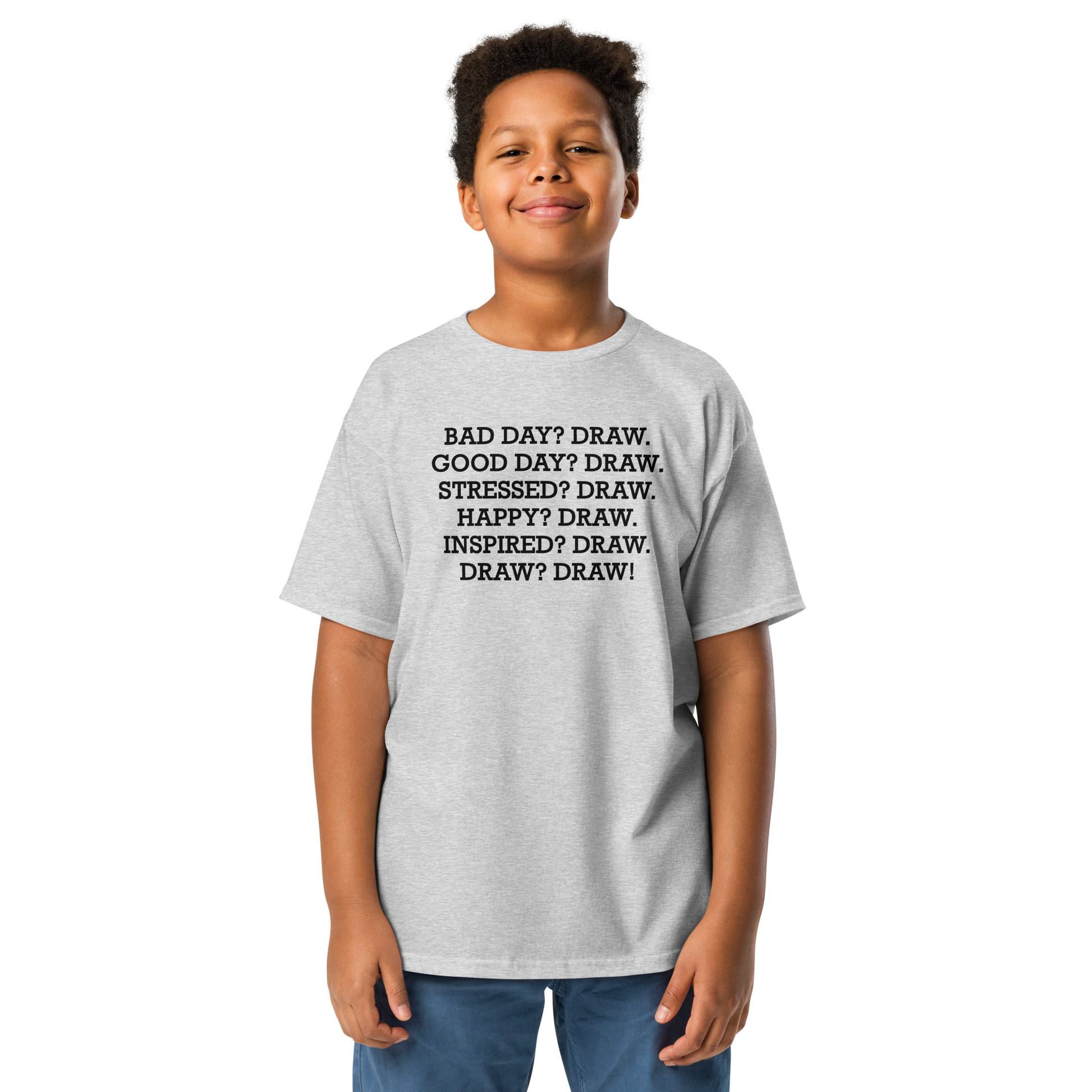 "Bad Day? Draw. Good Day? Draw. Stressed? Draw. Happy? Draw. Inspired? Draw. Draw? Draw!" printed on a sport grey youth classic tee worn by a male