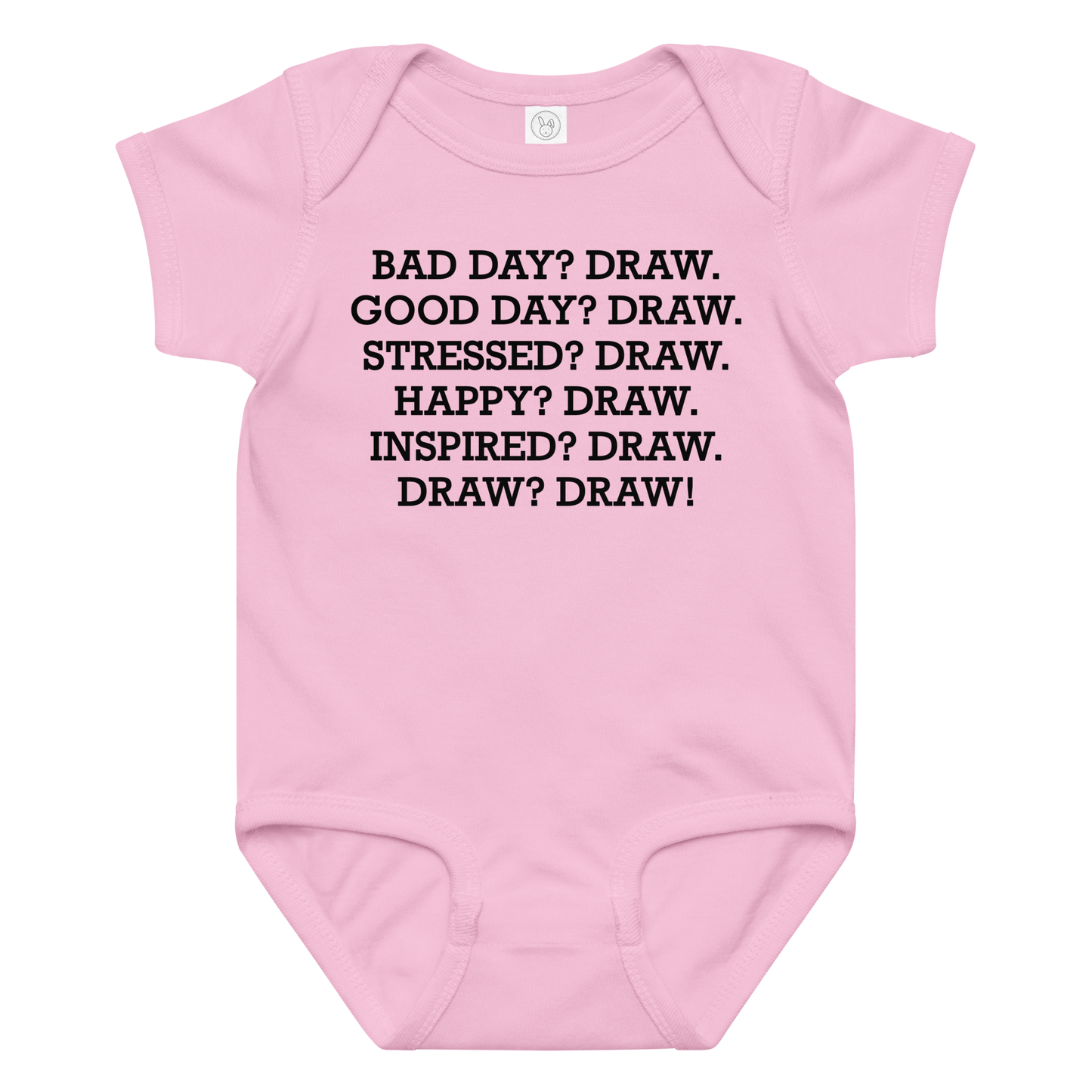 "Bad Day? Draw. Good Day? Draw. Stressed? Draw. Happy? Draw. Inspired? Draw. Draw? Draw!" printed on a pink baby jersey bodysuit laying on a flat surface amongst other clothes