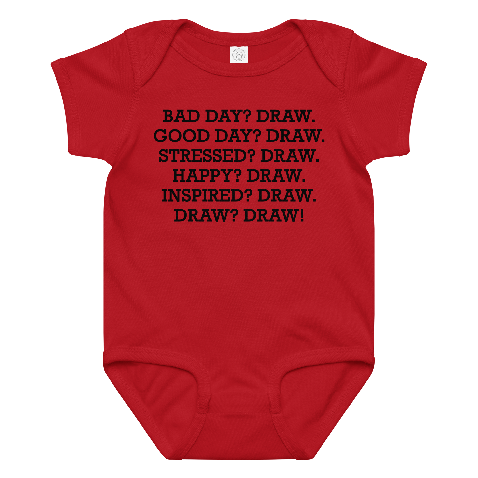 "Bad Day? Draw. Good Day? Draw. Stressed? Draw. Happy? Draw. Inspired? Draw. Draw? Draw!" printed on a red baby jersey bodysuit laying on a flat surface amongst other clothes