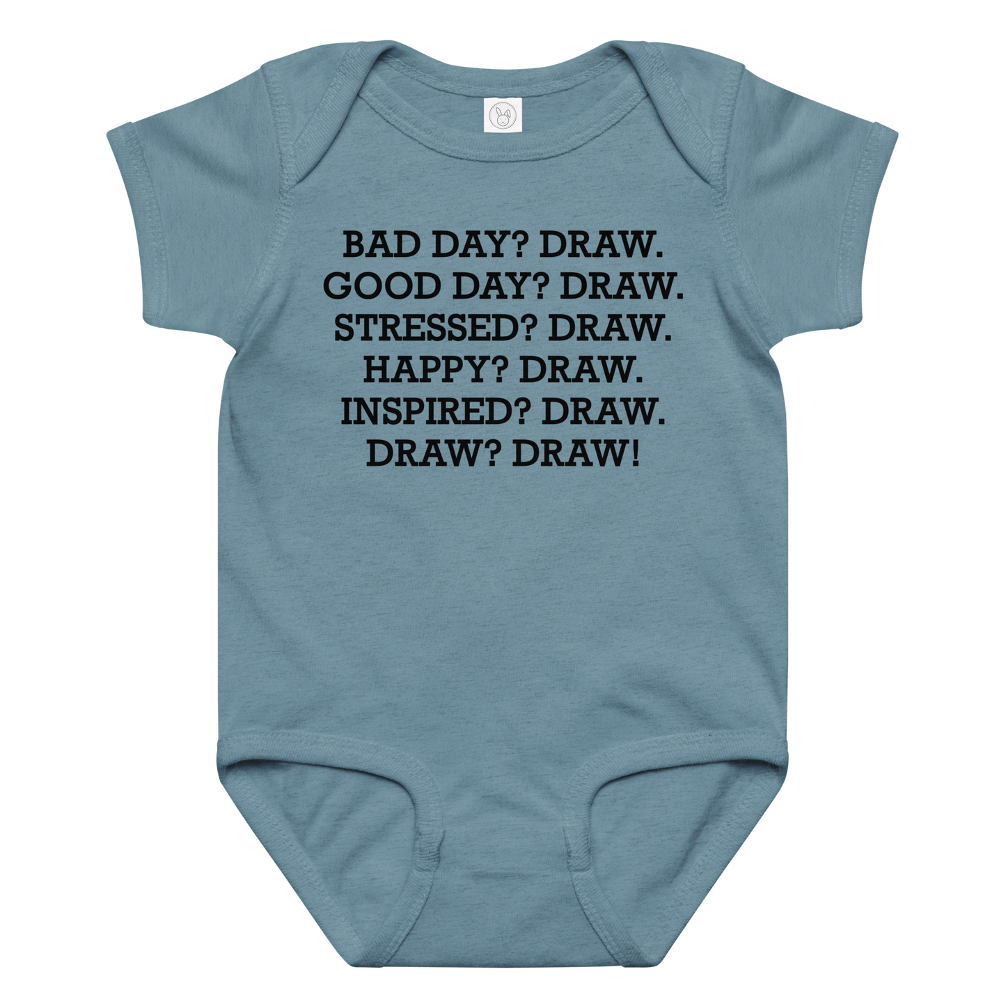 "Bad Day? Draw. Good Day? Draw. Stressed? Draw. Happy? Draw. Inspired? Draw. Draw? Draw!" printed on a vintage indigo baby jersey bodysuit laying on a flat surface amongst other clothes