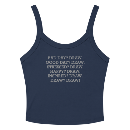 "Bad Day? Draw. Good Day? Draw. Stressed? Draw. Happy? Draw. Inspired? Draw. Draw? Draw!" printed on a solid navy blend women's micro-rib tanktop laying on a flat surface amongst sunglasses and shorts