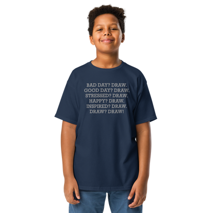 "Bad Day? Draw. Good Day? Draw. Stressed? Draw. Happy? Draw. Inspired? Draw. Draw? Draw!" printed on a navy youth classic tee worn by a male