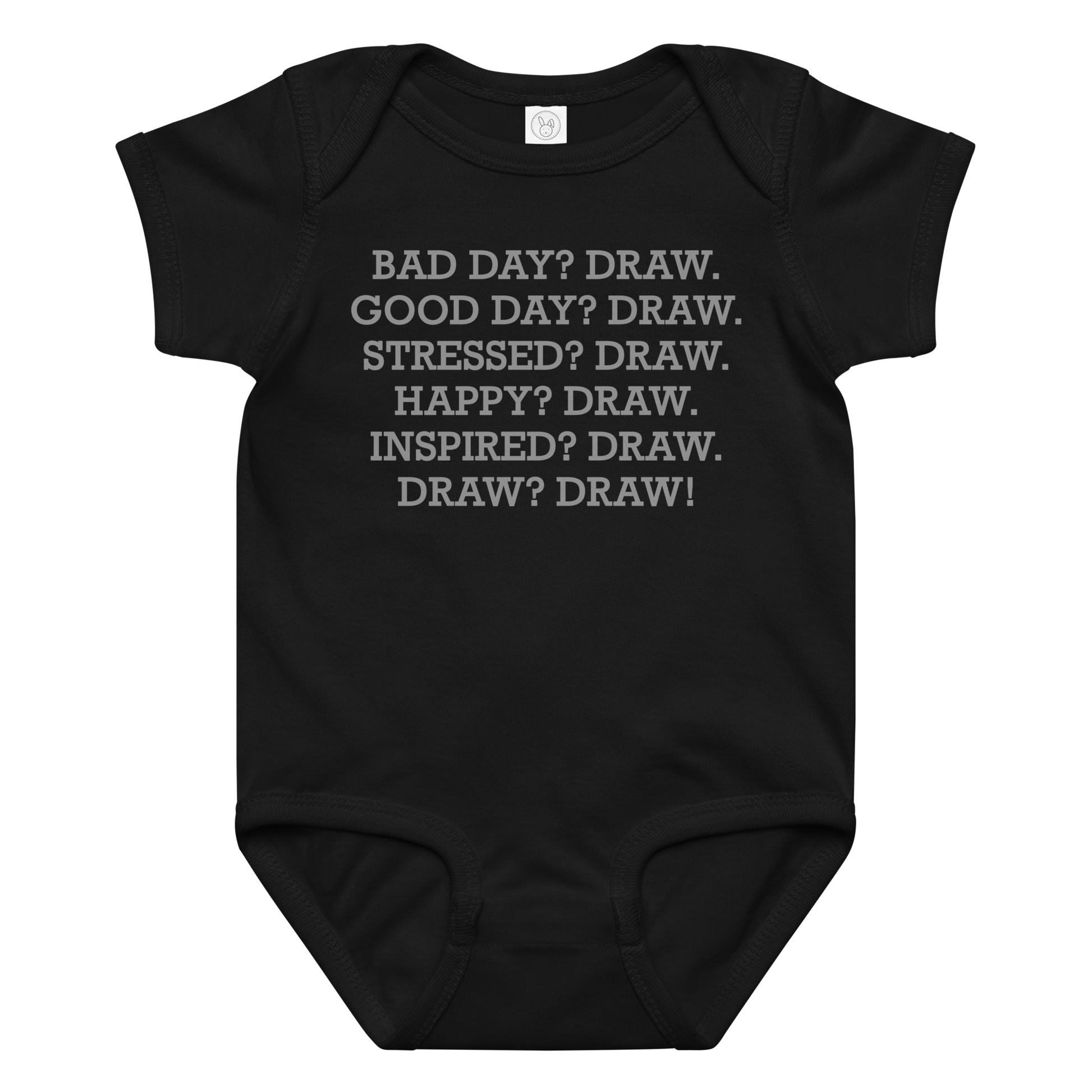"Bad Day? Draw. Good Day? Draw. Stressed? Draw. Happy? Draw. Inspired? Draw. Draw? Draw!" printed on a black baby jersey bodysuit laying on a flat surface amongst other clothes