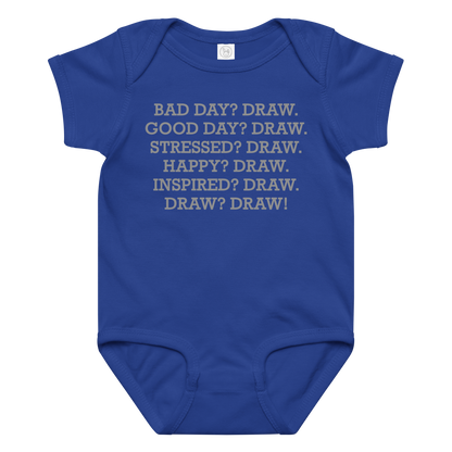 "Bad Day? Draw. Good Day? Draw. Stressed? Draw. Happy? Draw. Inspired? Draw. Draw? Draw!" printed on a royal baby jersey bodysuit laying on a flat surface amongst other clothes