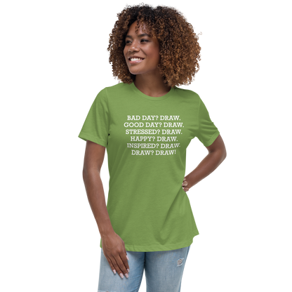"Bad Day? Draw. Good Day? Draw. Stressed? Draw. Happy? Draw. Inspired? Draw. Draw? Draw!" printed on a leaf women's relaxed t-shirt worn by a female