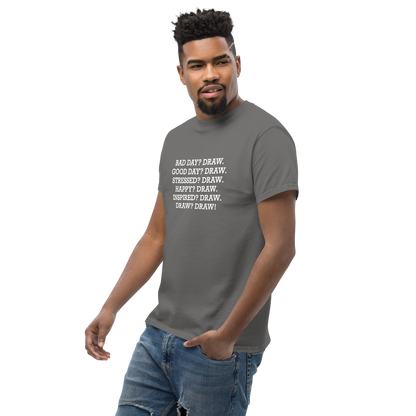 "Bad Day? Draw. Good Day? Draw. Stressed? Draw. Happy? Draw. Inspired? Draw. Draw? Draw!" printed on a charcoal unisex classic tee worn by a male