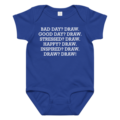 "Bad Day? Draw. Good Day? Draw. Stressed? Draw. Happy? Draw. Inspired? Draw. Draw? Draw!" printed on a royal baby jersey bodysuit laying on a flat surface amongst other clothes