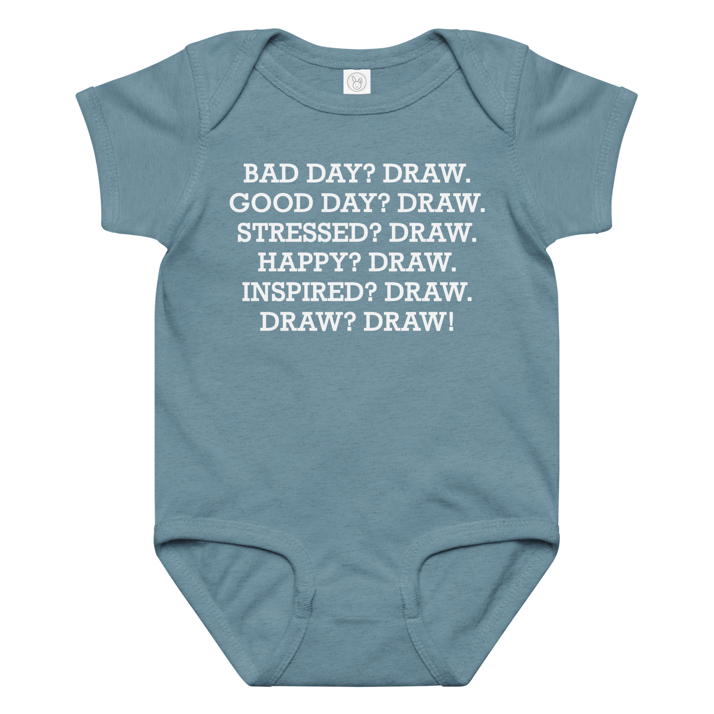 "Bad Day? Draw. Good Day? Draw. Stressed? Draw. Happy? Draw. Inspired? Draw. Draw? Draw!" printed on a vintage indigo baby jersey bodysuit laying on a flat surface amongst other clothes