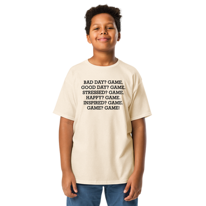 "Bad Day? Game. Good Day? Game. Stressed? Game. Happy? Game. Inspired? Game. Game? Game!" printed on a natural youth classic tee worn by a male