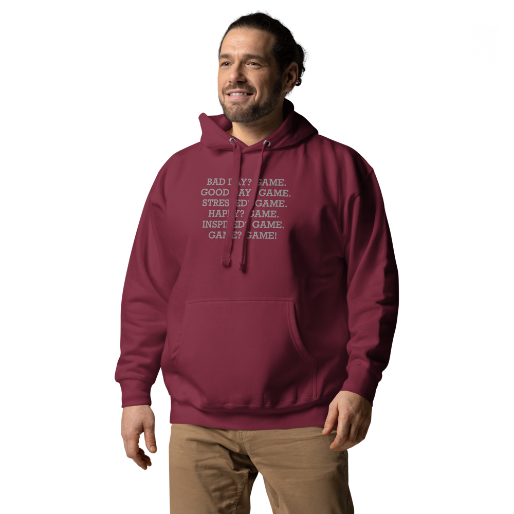 "Bad Day? Game. Good Day? Game. Stressed? Game. Happy? Game. Inspired? Game. Game? Game!" printed on a maroon unisex hoodie worn by a male