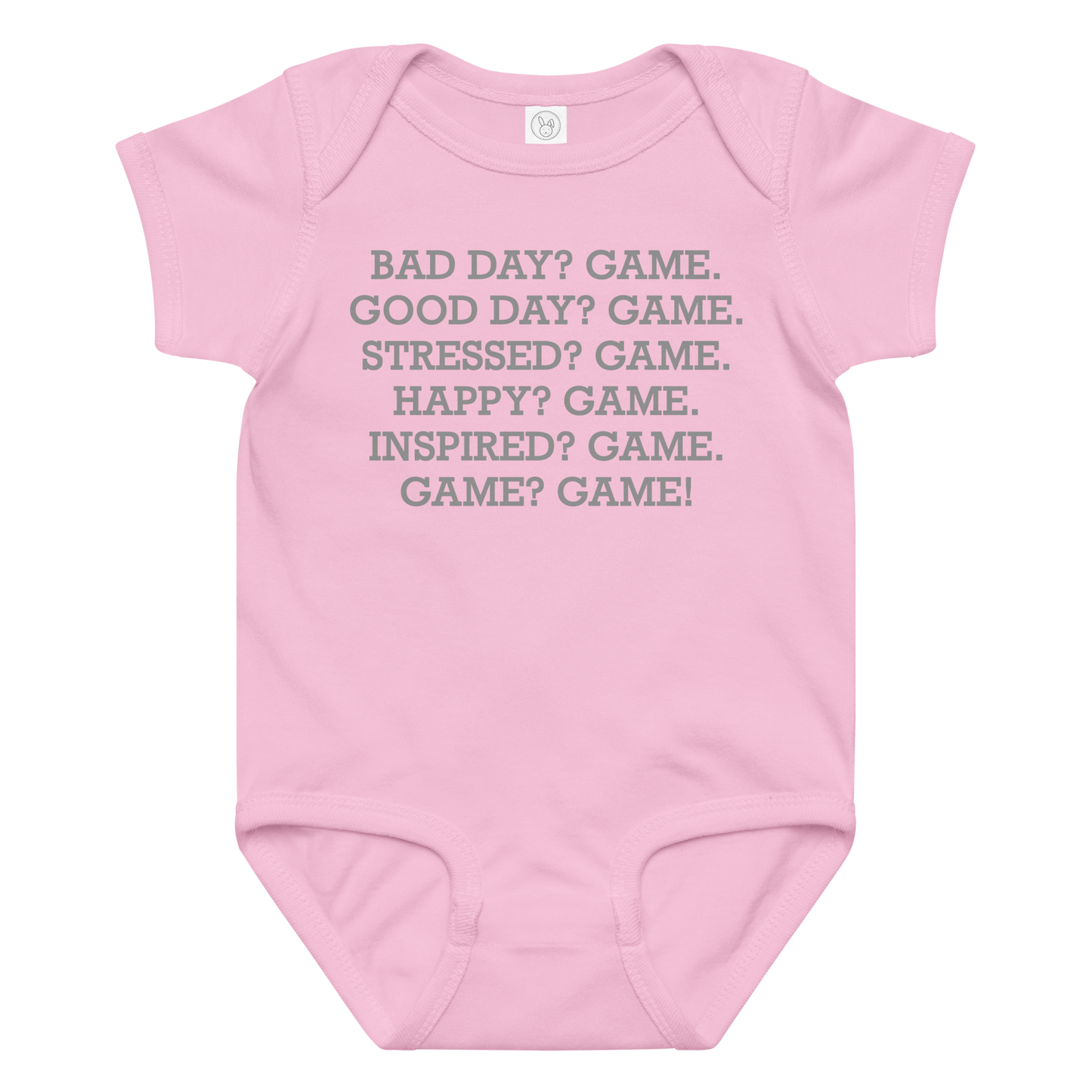 "Bad Day? Game. Good Day? Game. Stressed? Game. Happy? Game. Inspired? Game. Game? Game!" printed on a pink baby jersey bodysuit laying on a flat surface amongst other clothes