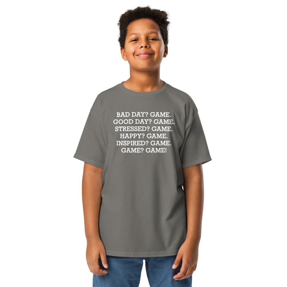"Bad Day? Game. Good Day? Game. Stressed? Game. Happy? Game. Inspired? Game. Game? Game!" printed on a charcoal youth classic tee worn by a male